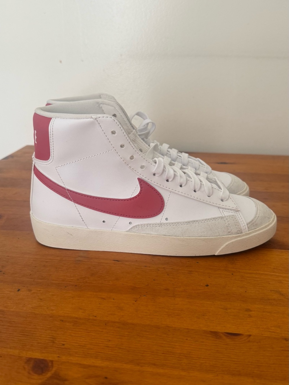 Nike Women’s White High-Top Sneakers with Rose Pink Swoosh